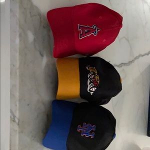 3 caps with sport team logo.